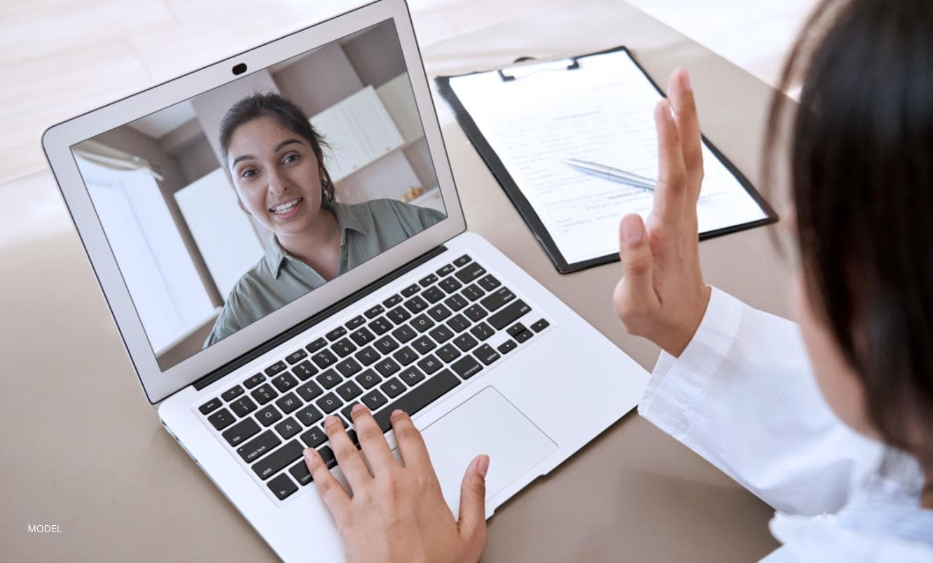 A patient talking to a doctor through a video call